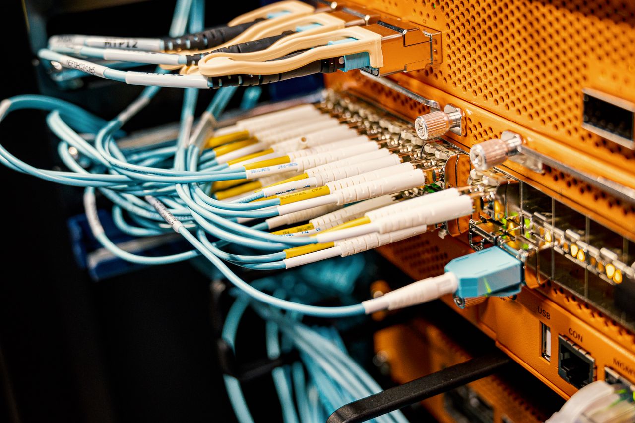 Mastering the First Impression: Your intriguing post title goes here Modern hardware and structured cabling system with patch cords inserted into patch panel outlets